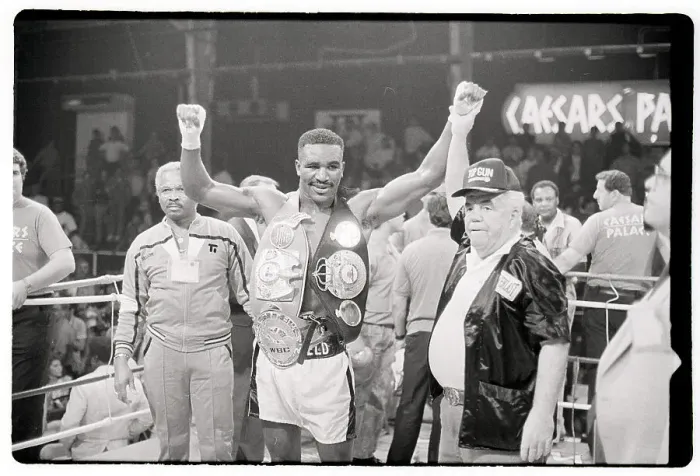 Framed Print : Evander Holyfield Raises Arms Wears Belt