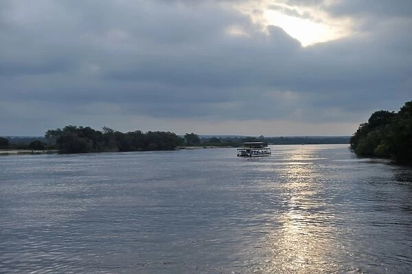 Evening cruise aside The Victoria Falls in Zambia at sunset
