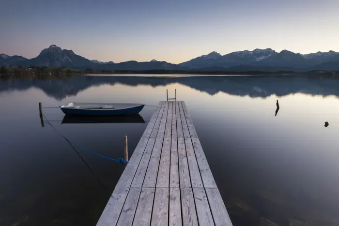 Framed Print : Evening light on Hopfensee Lake with jetty and rowing boat, Allgaeu Alps at back, Fuessen, Ostallgaeu region, Allgaeu, Bavaria, Germany, Europe Framed Print : Evening light on Hopfensee Lake with jetty and rowing boat, Allgaeu Alps at back, Fuessen, Ostallgaeu region, Allgaeu, Bavaria, Germany, Europe