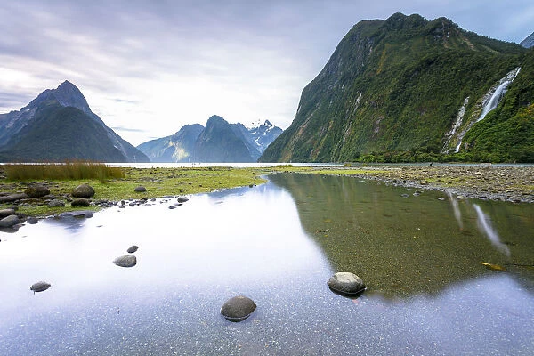 Evening at Milford Sound with Mitre Peak, 1683m, Cascade Peak, 1209m, and the Bowen Falls, 162m, Fiordland National Park, Southland Region, New Zealand