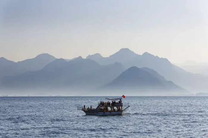Framed Print : Excursion boat on the sea, in front of the Taurus Mountains, Lycian Taurus, Antalya, Turkish Riviera, Province of Antalya, Mediterranean Region, Turkey