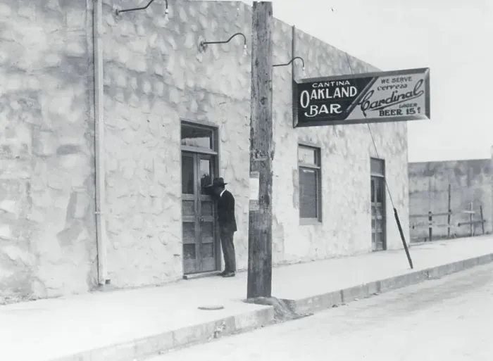 Framed Print : Exterior View of Man Standing at Doorway of Cantina Establishment Framed Print : Exterior View of Man Standing at Doorway of Cantina Establishment