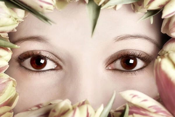 Eyes of a woman framed by tulips