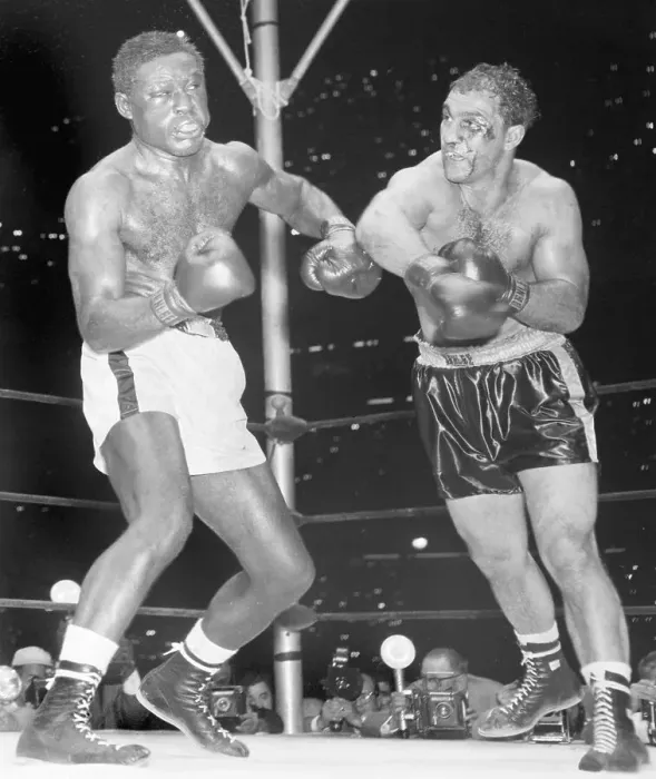 Framed Print : Ezzard Charles Punched by Rocky Marciano Framed Print : Ezzard Charles Punched by Rocky Marciano
