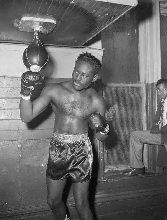 Framed Print : Ezzard Charles Punching Bag