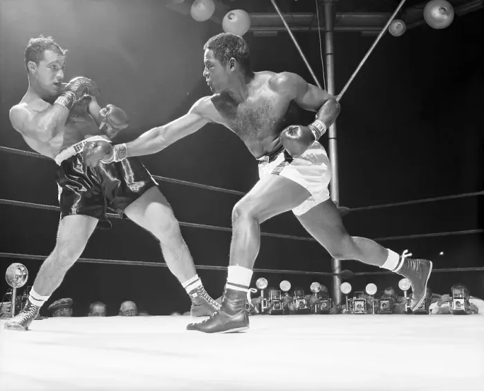 Framed Print : Ezzard Charles Throws Punch @ R.Marciano