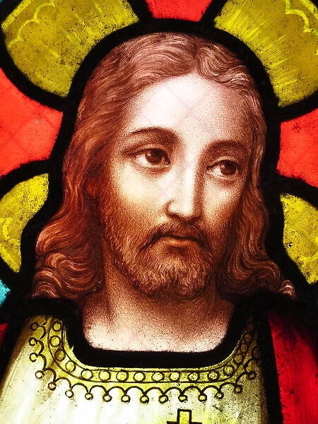 The face of Jesus Christ on an antique stained glass window