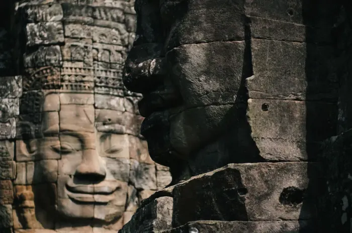 Framed Print : Faces of the sculptures in Bayon temple, Angkor Thom, Cambodia