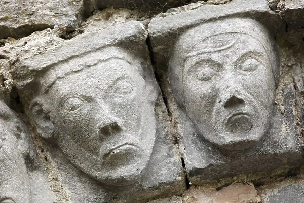 Faces of stone, Dysert O Dea church ruins near Corofin, County Clare, Ireland, Europe