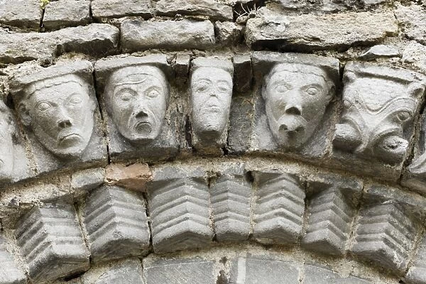 Faces of stone, Dysert O Dea church ruins near Corofin, County Clare, Ireland, Europe