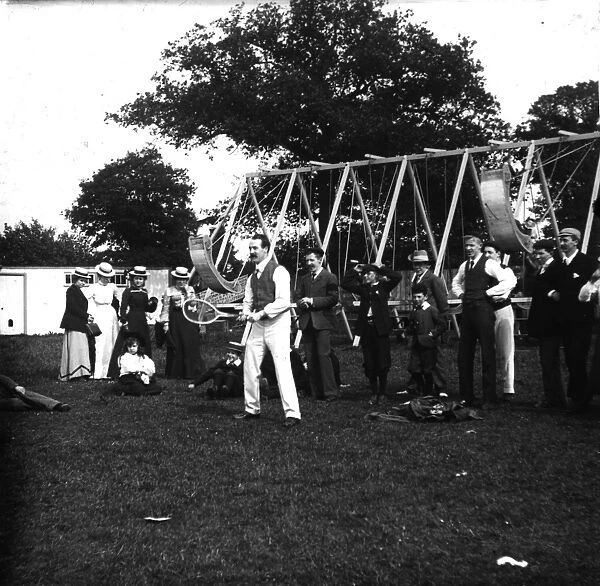 Fair Fun. circa 1890: An impromptu game of tennis at the Hampstead Fair, London