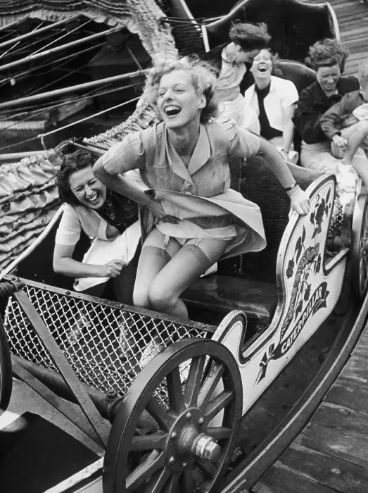 Framed Print : Fair Fun. Two young women enjoying themselves on the Caterpillar ride at Southend Fair