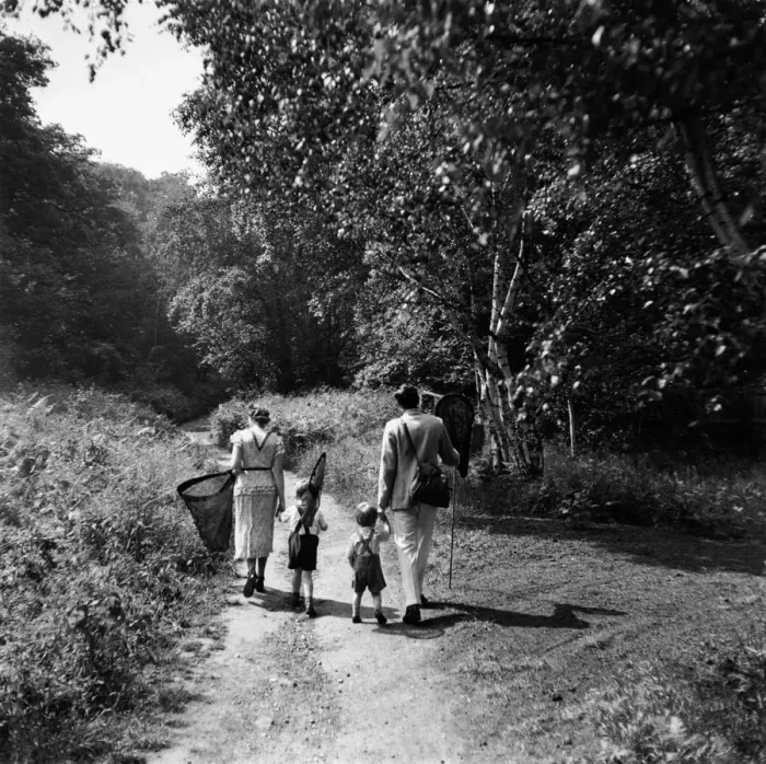 Framed Print : Family carrying butterfly nets, rear view (B&W) Framed Print : Family carrying butterfly nets, rear view (B&W)