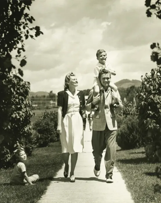 Framed Print : Family with two children (4-5) on walk, (B&W) Framed Print : Family with two children (4-5) on walk, (B&W)