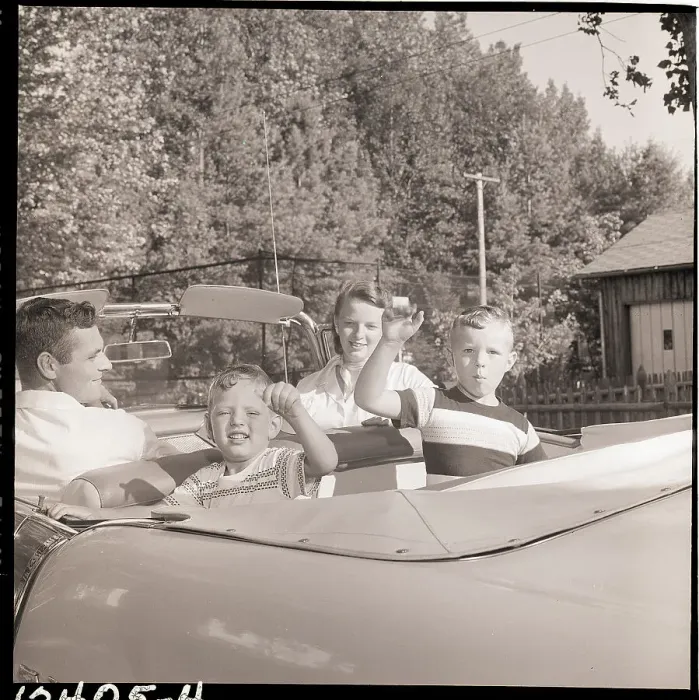 Framed Print : Family Drives Away In Convertible Framed Print : Family Drives Away In Convertible