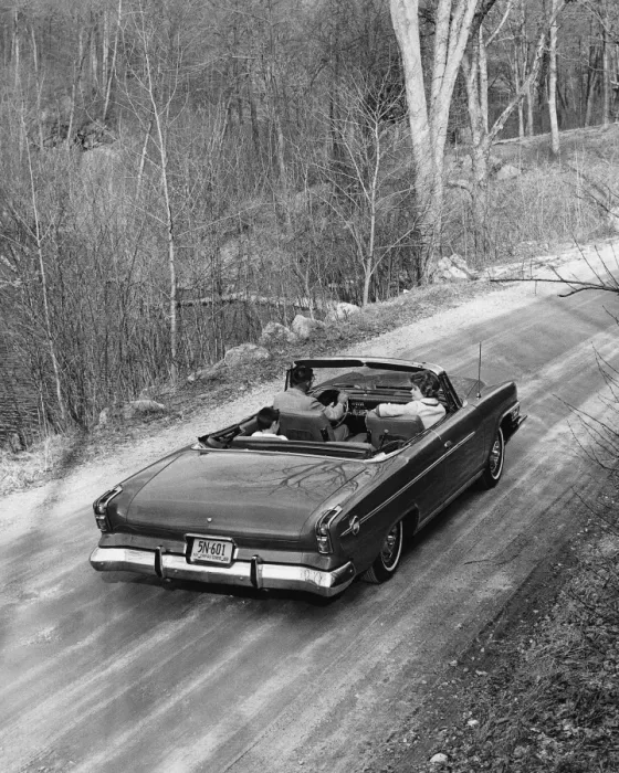 Framed Print : Family driving in convertible along country road Framed Print : Family driving in convertible along country road
