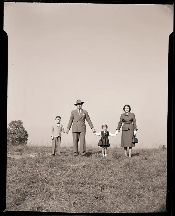 Framed Print : Family Holding Hands in Open Field Framed Print : Family Holding Hands in Open Field