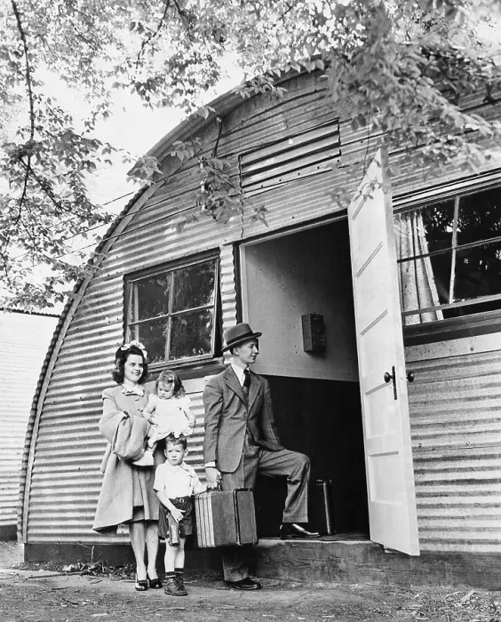 Framed Print : Family Move Into Hut-Like House Framed Print : Family Move Into Hut-Like House