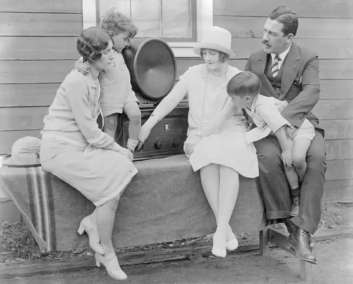 Framed Print : Family Members Listening to Radio Framed Print : Family Members Listening to Radio