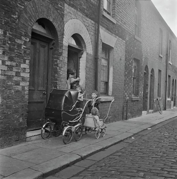 Framed Print : A Family Outside their Home In Salford Framed Print : A Family Outside their Home In Salford