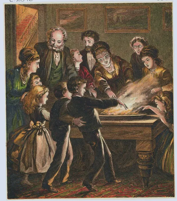 Framed Print : Family Playing Snap Dragon