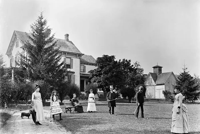 Framed Print : Family Plays Croquet in Front of Home