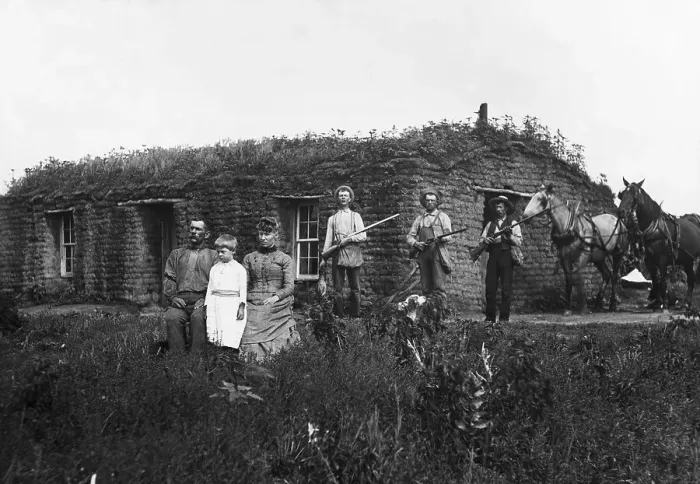Framed Print : Family Poses in Front of Sod House Framed Print : Family Poses in Front of Sod House