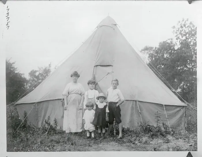 Framed Print : Family Posing in Front of Tent Framed Print : Family Posing in Front of Tent