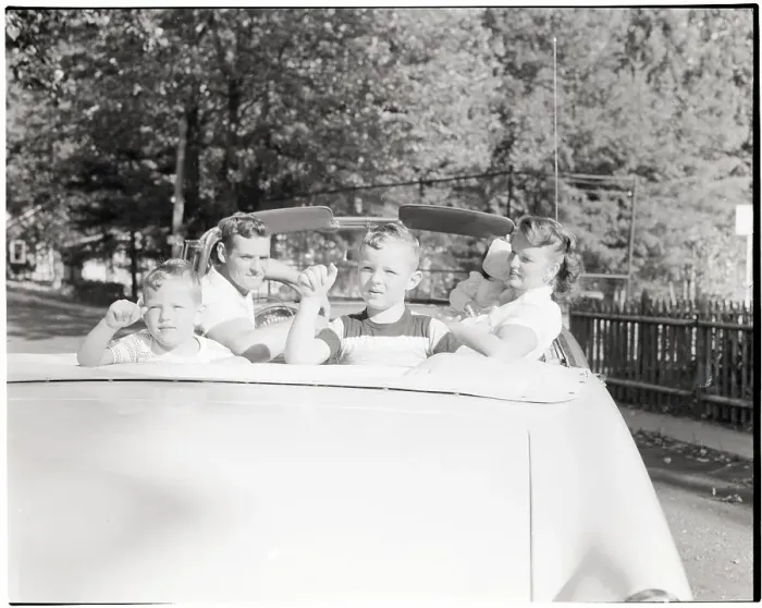 Framed Print : Family Seated in Convertible