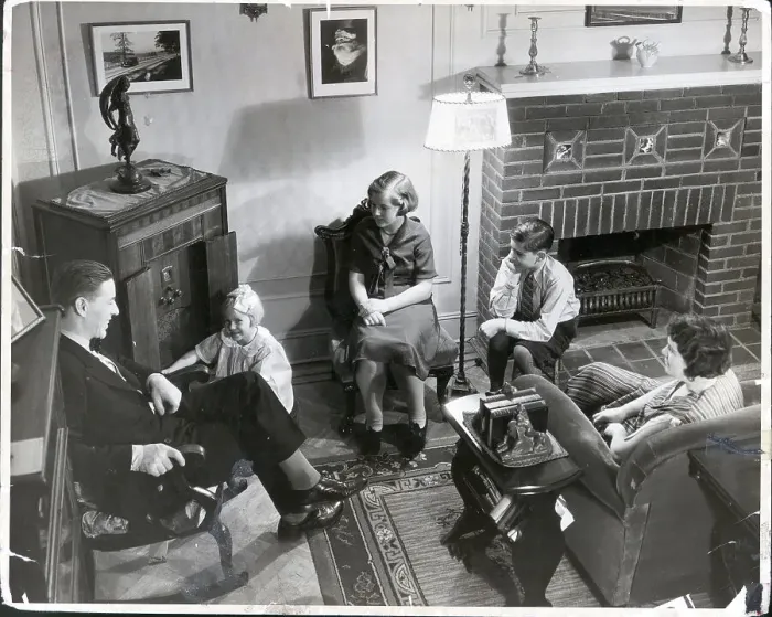 Framed Print : Family Seated in Living Room Around Radio Framed Print : Family Seated in Living Room Around Radio