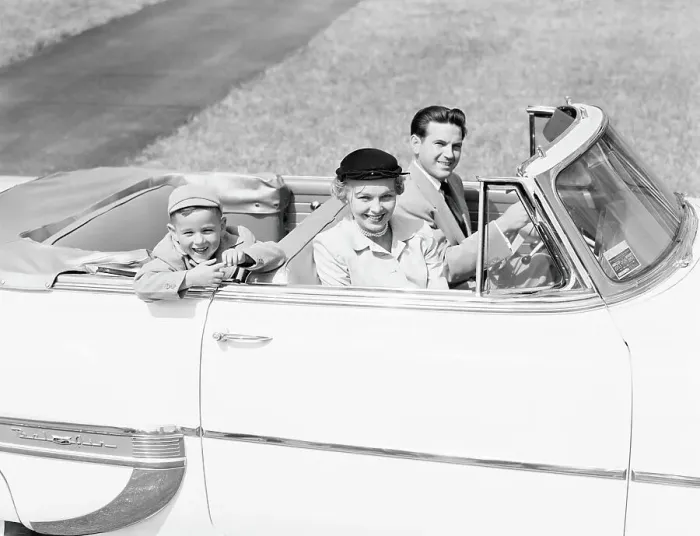 Framed Print : Family of three sitting in convertible car, smiling, portrait Framed Print : Family of three sitting in convertible car, smiling, portrait