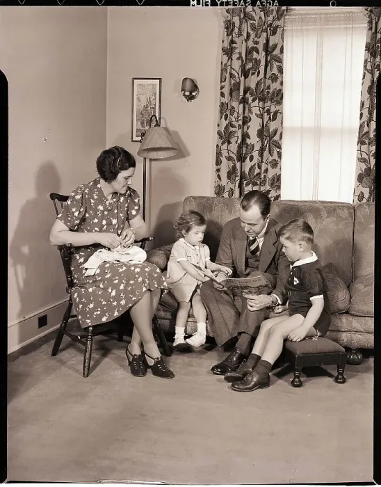 Framed Print : Family Sitting in Living Room Framed Print : Family Sitting in Living Room