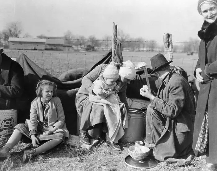 Framed Print : Family Sitting at Makeshift Camp Framed Print : Family Sitting at Makeshift Camp