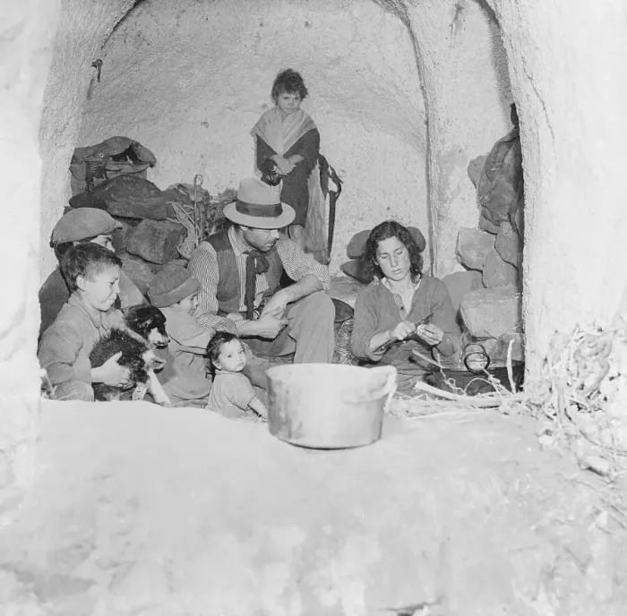 Framed Print : Family Squatting Near Fireside Framed Print : Family Squatting Near Fireside