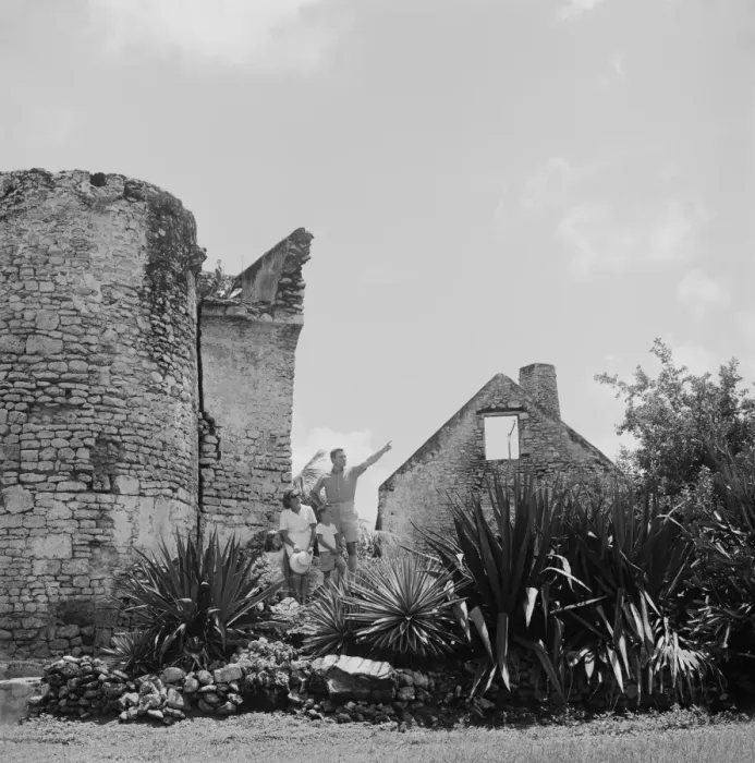Framed Print : Family standing beside old ruined, father pointing Framed Print : Family standing beside old ruined, father pointing