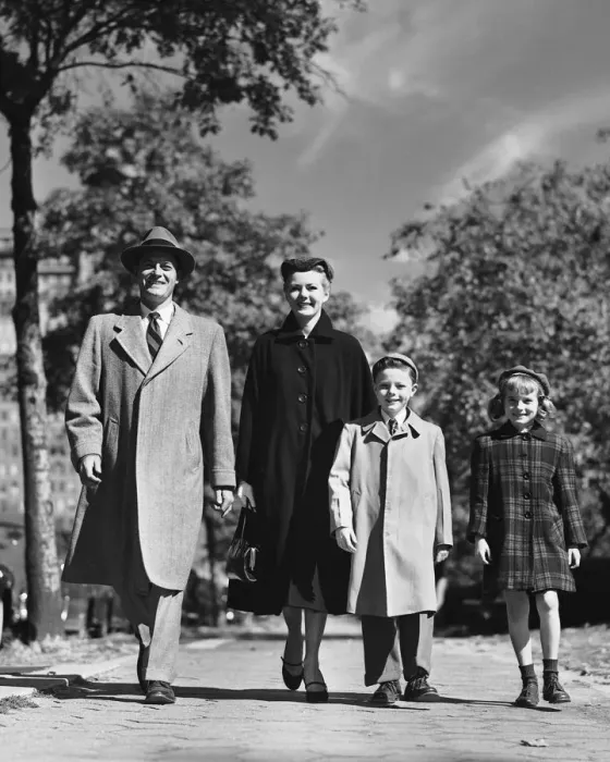 Framed Print : Family walking along street Framed Print : Family walking along street
