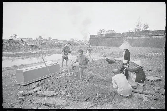 Framed Print : Family Watching Grave Diggers Framed Print : Family Watching Grave Diggers