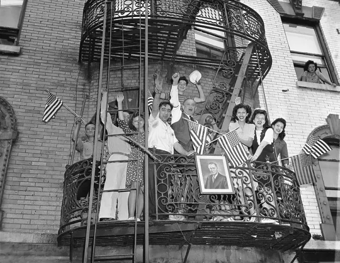 Framed Print : Family Waving American Flags on Fire Escape Framed Print : Family Waving American Flags on Fire Escape