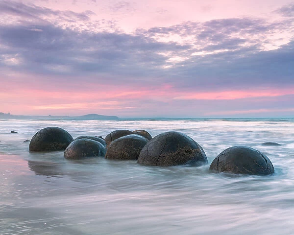 Famous Moeraki boulders at sunset, New Zealand