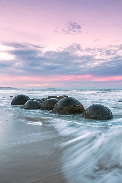 Famous Moeraki boulders at sunset, New Zealand