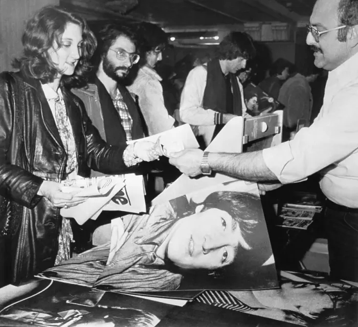 Framed Print : Fan Purchasing John Lennon Photo Framed Print : Fan Purchasing John Lennon Photo