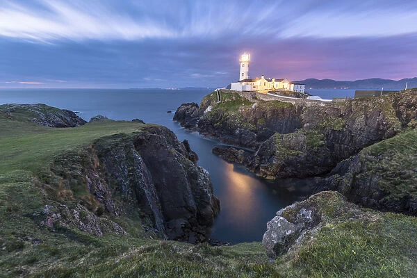 Fanad Head (FAanaid) lighthouse, County Donegal, Ulster region, Ireland, Europe. Lighthouse and its cove at night