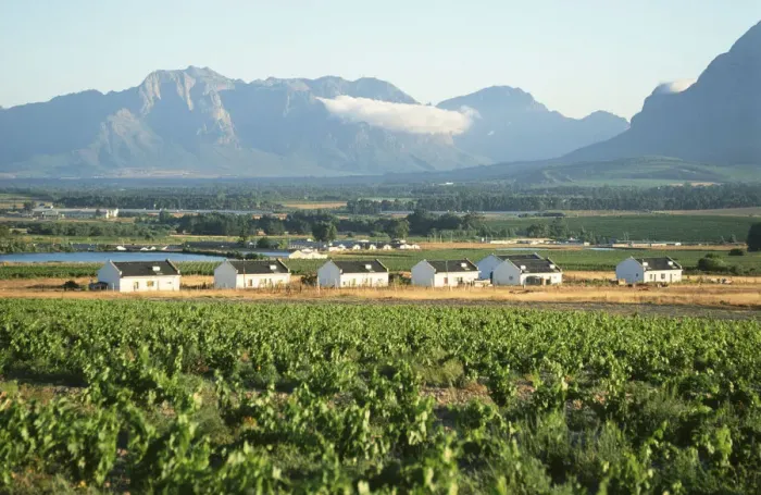 Framed Print : Farm Workers Cottages with Mountains in the Background