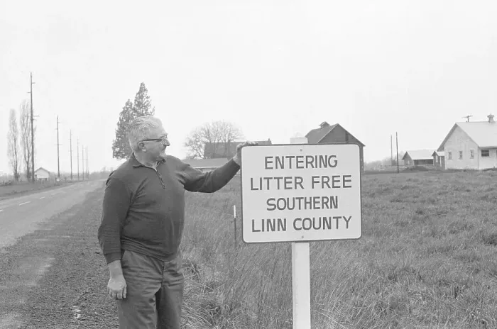 Framed Print : Farmer Stands Next To Sign; Litter-Free Framed Print : Farmer Stands Next To Sign; Litter-Free