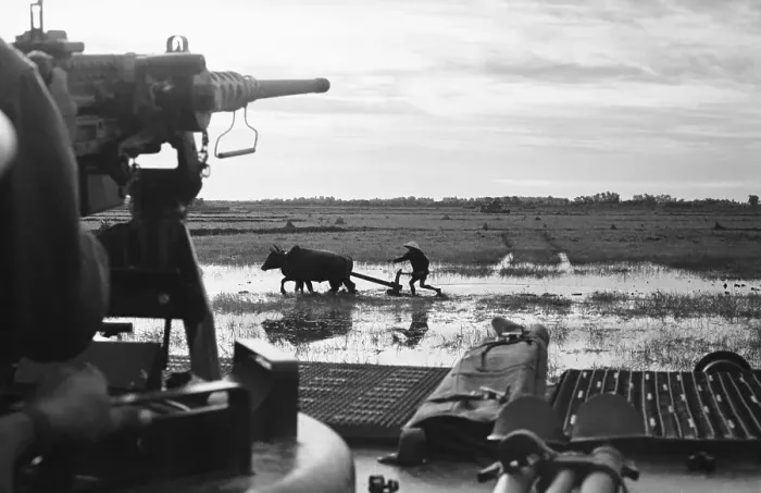 Framed Print : Farmer Working Under the Gun Framed Print : Farmer Working Under the Gun