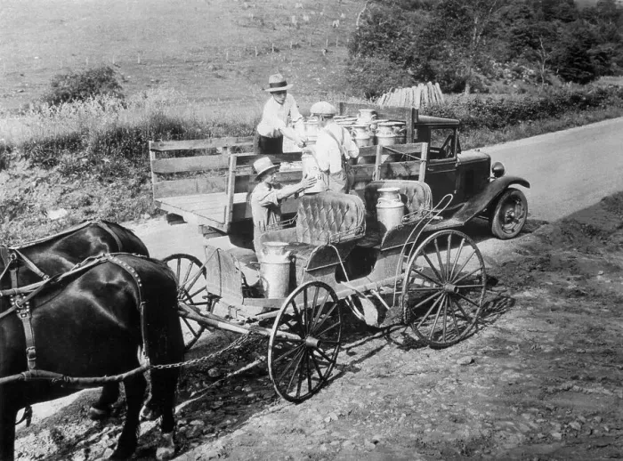 Framed Print : Farmers Handing Milk Cans to Delivery Driver Framed Print : Farmers Handing Milk Cans to Delivery Driver