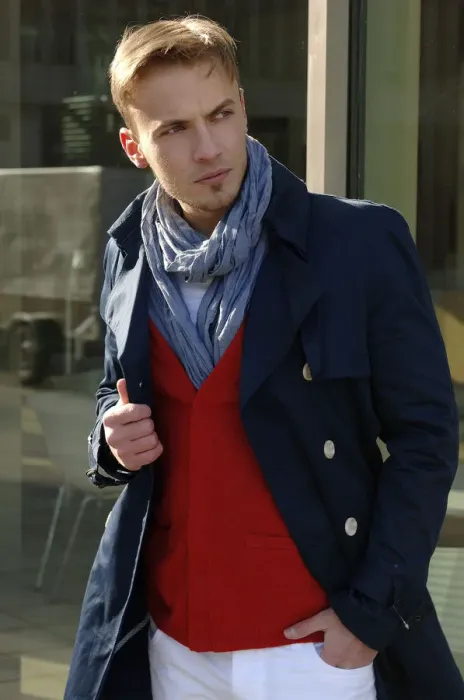 Framed Print : Fashion image, young man wearing a blue coat and a red sweater Framed Print : Fashion image, young man wearing a blue coat and a red sweater