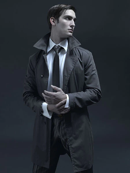 Fashion shot of a man in a suit and jacket