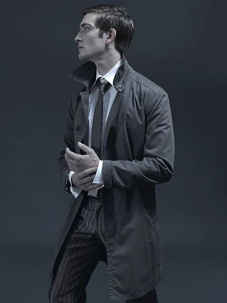 Fashion shot of a man in a suit and jacket