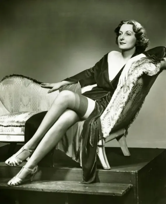 Framed Print : Fashionable woman in stockings sitting on chaise longue, (B&W), portrait Framed Print : Fashionable woman in stockings sitting on chaise longue, (B&W), portrait